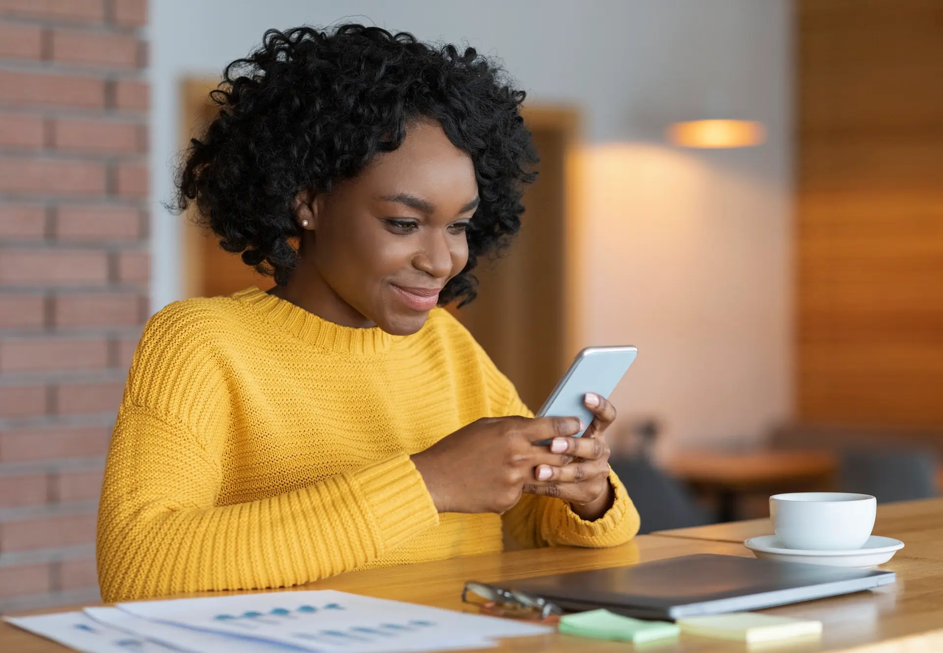 woman-in-yellow-with-phone